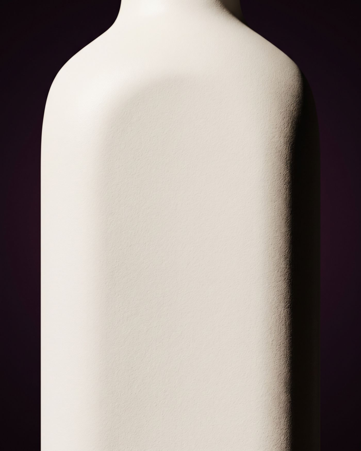 The blank back panel of a plain white bottle in close view.